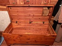 Open view of vintage Lane cedar chest showing interior cedar wood lining and safety label.