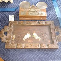 Image showing both the decorative wooden tray with carved border and glass insert and the wooden balance scale with metal pans and weights.