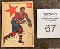 Front of the 1954-55 Parkhurst Doug Harvey hockey card #14 showing player skating in Montreal Canadiens uniform with red star and card number 14 in the upper right corner