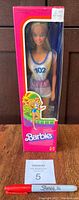 Front view of original unopened boxed 1981 Jogging Barbie doll, showing the doll inside wearing jogging outfit number 102, with pink packaging and doll standing upright