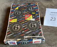 Top and front view of the sealed Original 6 Hockey wax box from 1992 with factory wrap mostly intact, showing branding and the six NHL team names.