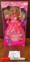 Front view of the 3 Looks Barbie doll in original unopened pink box showing the doll in a formal pink dress.