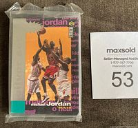 Front view of sealed Michael Jordan 1995-96 Upper Deck Crash The Game Silver set packaging in shrink wrap showing basketball action on the front, product logos and text.