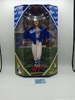 Full frontal image of the Dodgers Barbie doll in original unopened box with Dodgers branding and MLB logos.