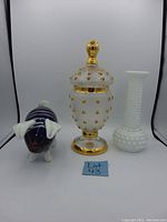 Front view showing all three items: glass pig figurine on the left, vintage candy dish in center, milk glass bud vase on the right