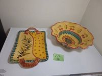 Photo of hand painted Italian ceramic serving platter and large bowl with Lot 76 note.