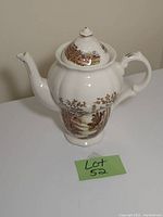 Front side view of the vintage Bring ceramic teapot with scenic landscape print and spout visible, showing a small repair.