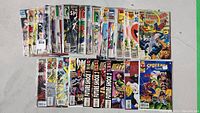 Wide shot of 39 assorted Spider-Man comics arranged side by side, showing front covers.