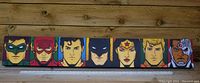 Front view of the Justice League canvas showing six character panels