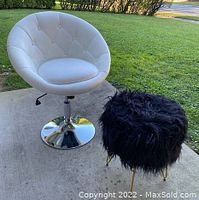 White textured vinyl swivel chair situated outdoors, showing overall style and condition.