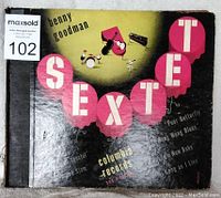 Original album sleeve for Benny Goodman Sextet 78 RPM record set with stylized lettering and instrument silhouettes.