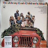 Front view of the vinyl record sleeve showing the album cover with Johnny Cash and children around a red jeep with greenery.