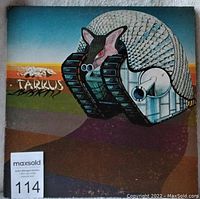 Front cover of Tarkus album with mechanized armadillo-tank artwork and auction label 114.