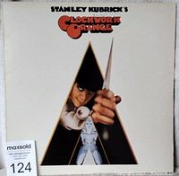 Front cover of Stanley Kubrick's Clockwork Orange LP showing film character holding a knife in a triangular cutout.