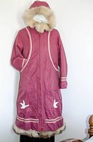 Front view of maroon double layer parka with fur trimmed hood and large pockets