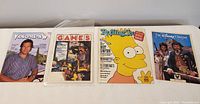 Photo showing four different magazines from the 1980s including Rolling Stone with Bart Simpson on the cover
