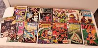 Photo showing full lot of 15 comic books arranged in two rows on a white surface: Spider-Man, Star Trek, Dune, Classic X-Men, Fantastic Four, Indiana Jones, Star Brand, Kull, Warriors, Star Wars, Marvel's Greatest Comics.