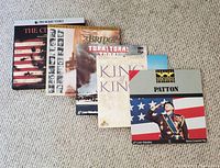 Five LaserDisc movie boxes laid side by side showing cover art. The Civil War Ken Burns edition is visible along with A Bridge Too Far, Tora! Tora! Tora!, King of Kings, and Patton.