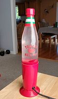 Vintage tomato ketchup styled lava lamp with red base and clear bottle, needs bulb.