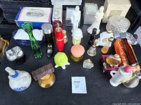 Full group overview of all Avon bottles and boxes displayed on a table