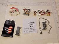 Full lot overview showing all pins, necklace, and other jewelry laid out with ruler for size reference