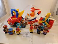 Full lot image showing all toys including vehicles and figures arranged front-facing with ruler for scale.