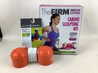 Gaiam Restore Neck Cradle with orange textured massage roller shaped like a dumbbell for therapeutic neck support.