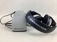Sennheiser wireless headphones placed beside the receiver unit, clearly showing brand logos.