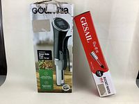 Shows Gourmia Sous Vide Pod with Timer in box alongside Gesail boxed water heater.