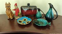 Full view of the lot showing all items together on wooden table under natural light