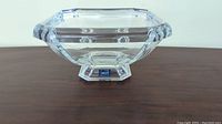Clear lead crystal footed bowl placed on wood surface with Mikasa label visible on the footed base.