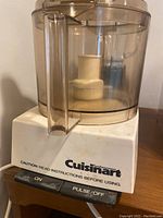Cuisinart food processor base and bowl from an angle showing controls and handle