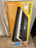Full boxed Casio CTK-2080 electronic keyboard in original packaging.