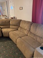 Sectional couch set showing corner unit and two straight sectional couch pieces upholstered in brown corduroy with visible stains and wear.