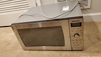 Front view of Panasonic microwave oven with stainless steel door and control panel