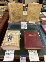 Photo showing all four gold rush guide books with printed labels describing each item's authorship and features.