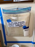 Two large vellum indenture contracts folded and contained in a clear plastic bag with a label indicating they are handwritten, dated 1846, 2 pages per indenture for warehouse property leases.