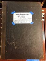 Cover of bound volume with black leather spine and taped label reading 'Scientific American 1851-1852'