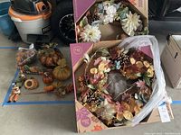 Full view of all fall decor items including wreaths, pumpkins, scarecrows, and sign