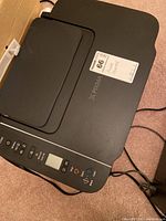 Top view of Canon PIXMA printer showing control panel and textured lid.