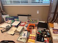 Wide view showing folders, envelopes, pens, markers, stapler, paper trimmer, and original post office scale with lock box.