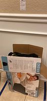 Boxed Intex Twin Pillow Rest Raised inflatable air mattress with built-in electric pump. Box shows text and images detailing product features.