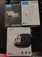 Front view of retail boxes including Soundcore Liberty Air 2 Pro earbuds, Liberty Air 2 earbuds, and Anker Ultra Clear speaker.