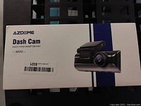 Front of AZDOME Dash Cam box showing product image and model M550