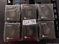 Photo showing six sealed boxes of Bluedio Hurricane wireless earbuds in black packaging arranged in two rows of three.