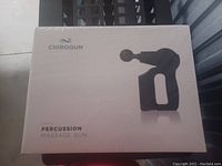 Sealed box of Chirogun Percussion Massage Gun showing front design and branding.