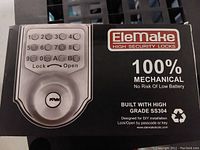 The front box of the EleMake lock showing the keypad and branding with technical info about the product.