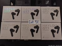 Six sealed boxes of Haylou GT7 true wireless earbuds displayed in two rows containing three boxes each.