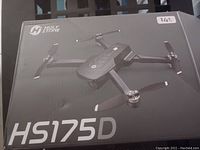 Box of Holy Stone HS175D drone showing drone image and model number on box front