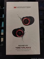 Front of sealed box showing Monster Achieve 100 Airlinks earbuds image and branding.